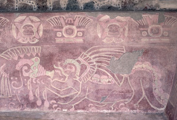 Detail of a polychrome Jaguar mural showing the animal blowing a conch shell