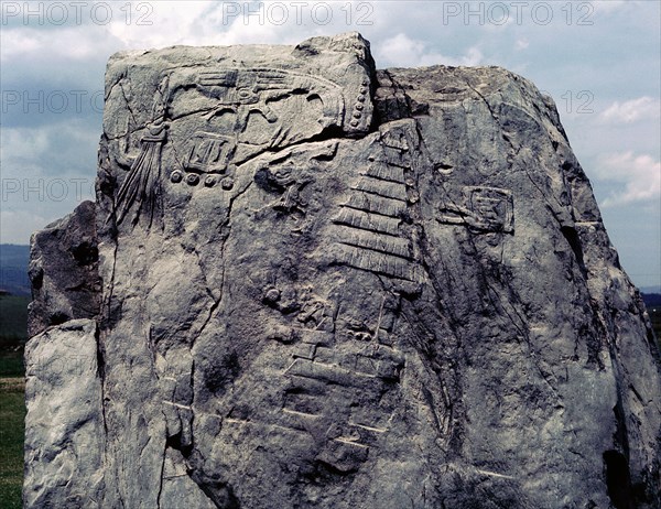 Colossal monolith with bas relief of a temple