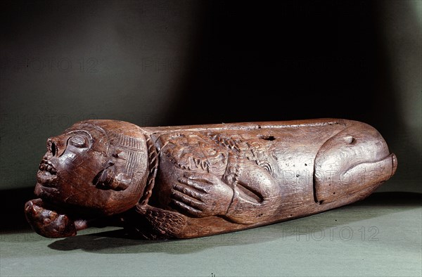 Teponaztli two toned drum in the form of a bound captive, probably a sacrificial victim