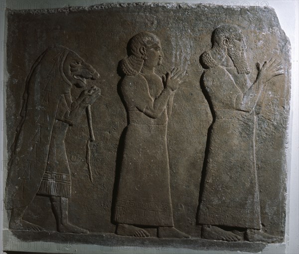Assyrian officials with a mummer