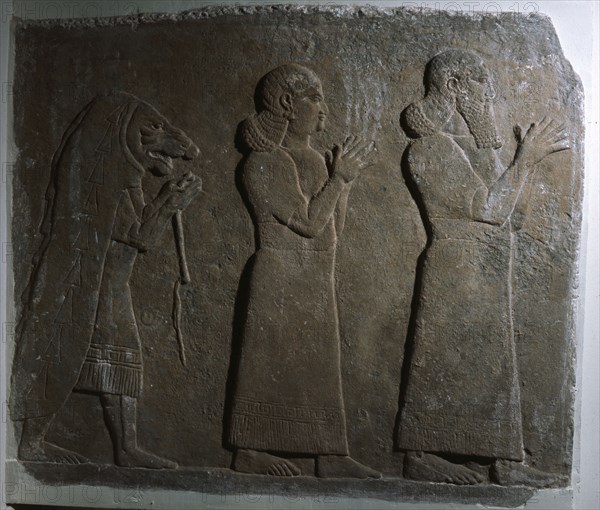 Assyrian officials with a mummer