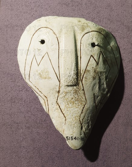 Conch shell incised with abstract face design Country of Origin: USA