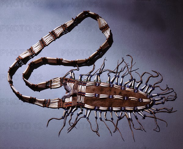 Cedar bark pouch decorated with glass beads obtained from Russian traders and dentolis shell from trade with the Northwest Coast