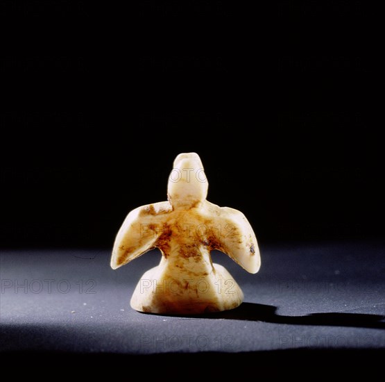 Small flat bottomed ivory carving of a sea bird, probably a gaming piece