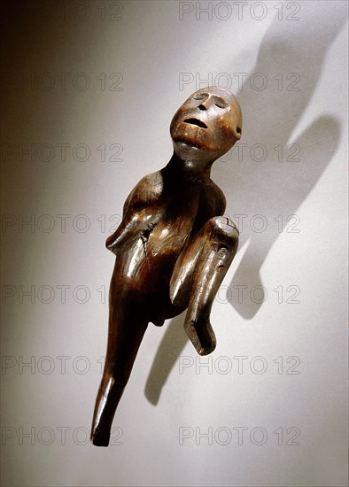 Wooden figure of an emaciated man, probably a shaman