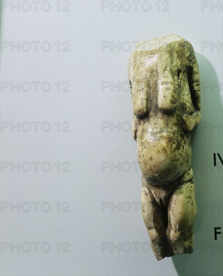 Headless female figure