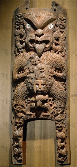 Figure surmounting the arched doorway of a storehouse, kuwaha pataka, symbolic of the gateway to the underworld