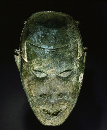 An ornamental hip mask which formed part of the regalia of the Benin king (Oba) and of important chiefs