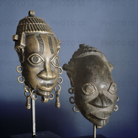 Two ornamental masks which formed part of the regalia of important chiefs in Benin
