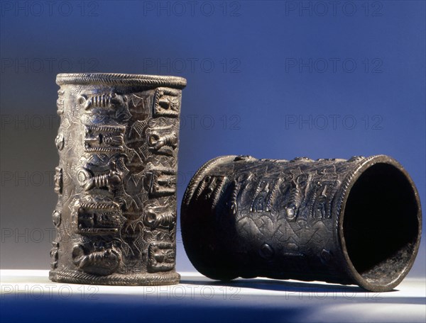 A pair of armlets with relief decoration