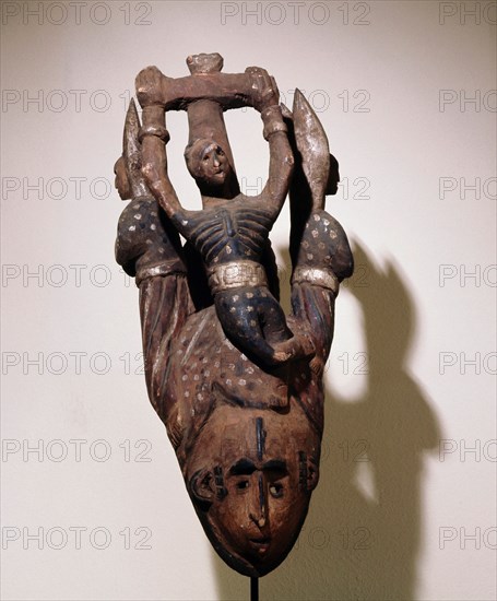 An Igbo mask of the white faced type that usually represent a beautiful girl