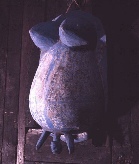 A body mask depicting a women in childbirth, worn by a male dancer during a masquerade held to placate and honour the reproductive and mystical powers of women and divert the threat of witchcraft