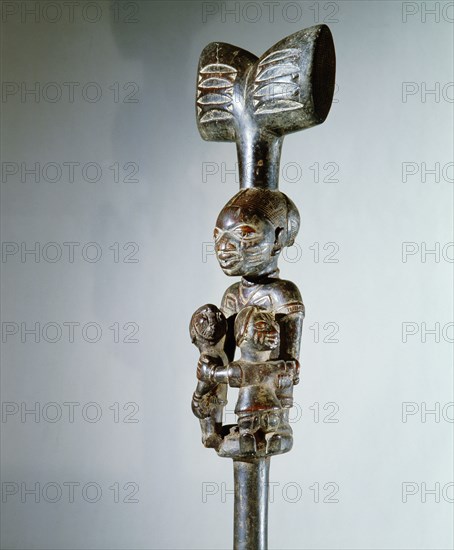 A staff used by devotees of Shango the Yoruba orisha of thunder and lightning, carried in dances when possessed by the deity