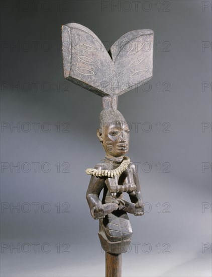 A staff used by devotees of Shango the Yoruba orisha of thunder and lightning, carried in dances when possessed by the deity