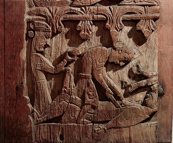 Detail of a carving from a stave church portal illustrating the story of Sigurd