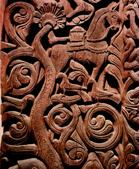 Detail of a carving from a stave church portal illustrating the story of Sigurd