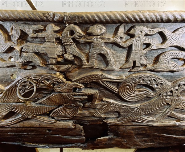 A detail of the decorative carving on the side of the Oseberg cart