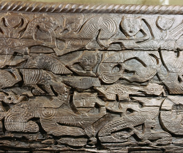A detail of the decorative carving on the side of the Oseberg cart