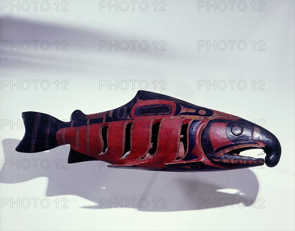 Rattle in the form of a salmon containing an effigy figure of a shaman