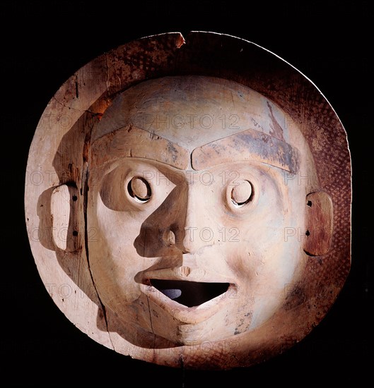 A mask carved to represent the moon