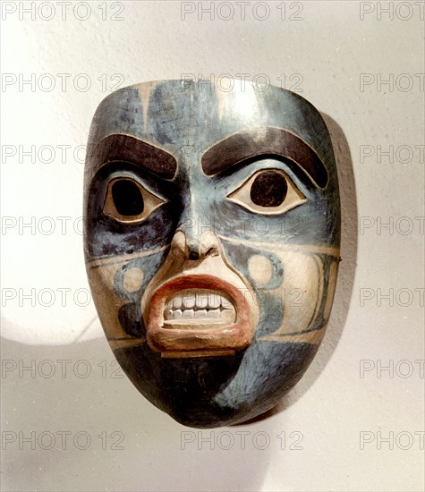 Wooden mask of a woman wearing a labret