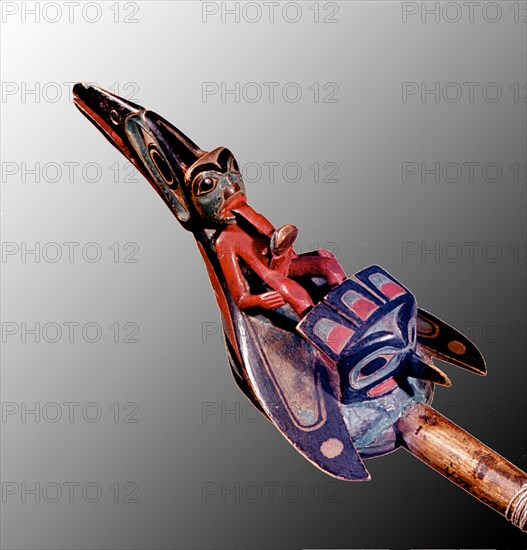 Shamans rattle shaped like a raven with the figure of a shaman on its back