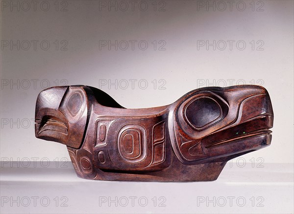 Wooden dish featuring both an eagle and a whale in a deliberate visual pun