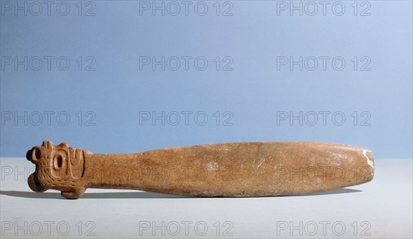 Flat bladed whalebone club with the handle carved as a head