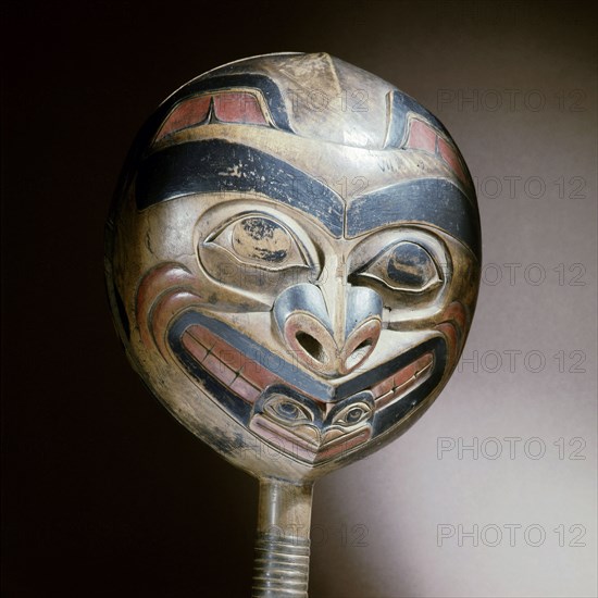 A shamans rattle carved with the design of a killer whale