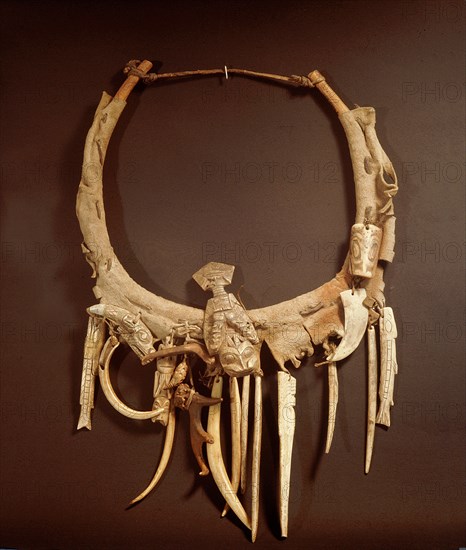 Part of a Haida shamans gear included a neckring from which various bone and ivory charms were suspended