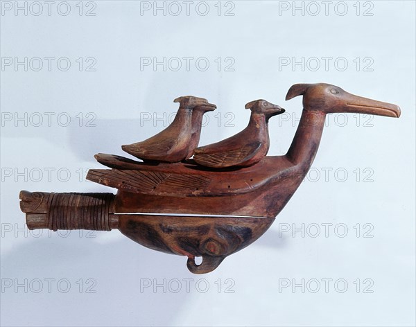 Shamans rattle in the form of a grebe with two smaller birds resting on its back