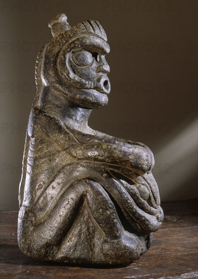 Stone human figure bowl, thought to have been used by Salish shamans in purification rites as part of ceremonies marking the onset of female puberty