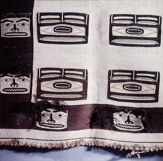 A woven Chilkat blanket which is unusual in that it is made of pure wool and not a mixture of wool and cedar bark