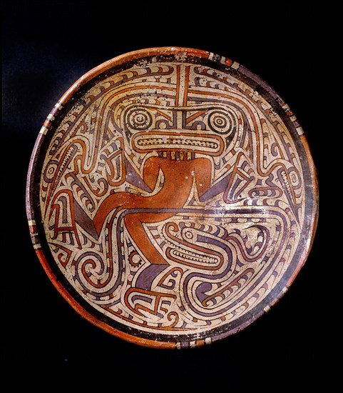 Elegant and typically Cocle style of polychrome ceramic plate, depicting dancing jaguar, crocodile, or supernatural creature, or even a shaman wearing a mask