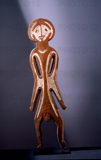 Painted two dimensional female figure incised on bark, from the Papuan Gulf area