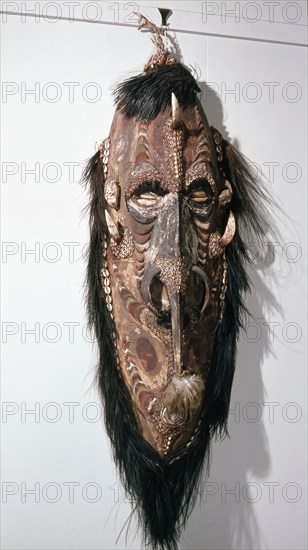 Large shield shaped mask that represents a female clan specific spirit