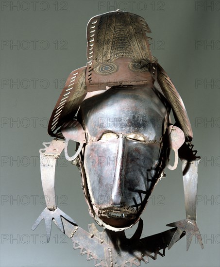 Torres Straits dance mask made from thin sheets of tortoise shell sewn together with palm fibres