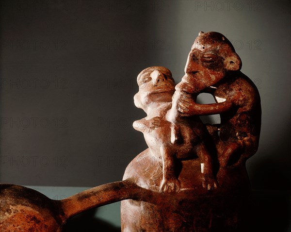 Double chambered ceramic vessel depicting an act of homosexual fellatio