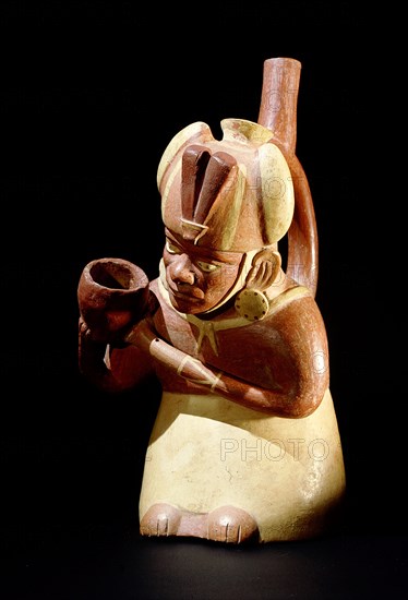 Stirrup spouted Mochica portrait jar depicting a noble pouring out water or chicha beer, probably as a libation associated with fertility rituals