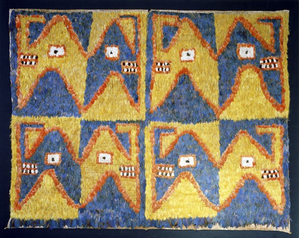 Featherwork tabbard with dragon head motif