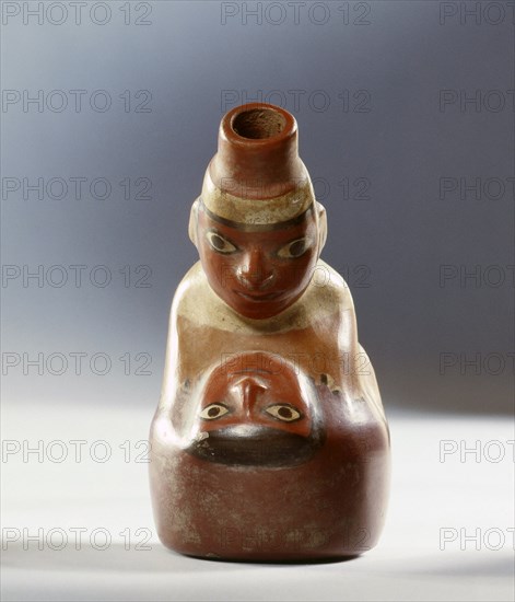 Polychrome Nazca effigy jar showing a couple in the act of sexual intercourse