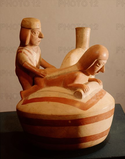 Stirrup spouted vessel depicting a copulating couple