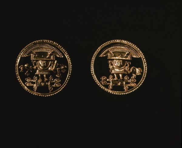 Elaborately cast gold discs, possibly earrings