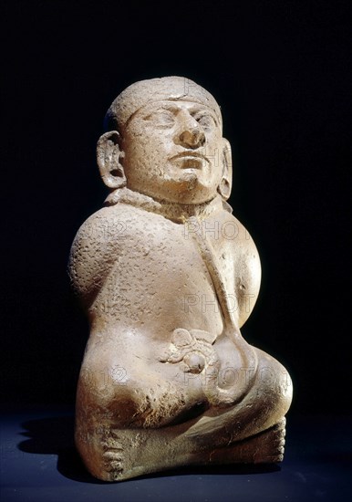 Mochica vessel in the form of a seated prisoner with his hands bound behind his back