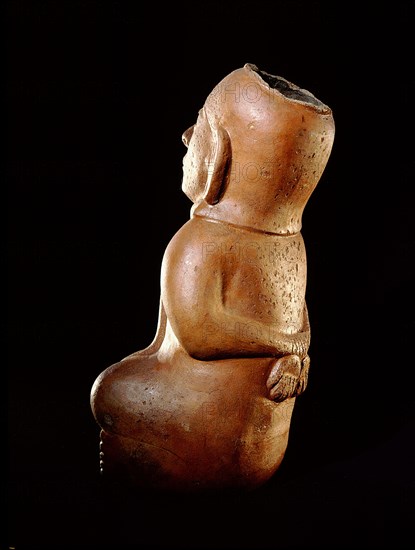 Mochica vessel in the form of a seated prisoner with his hands bound behind his back