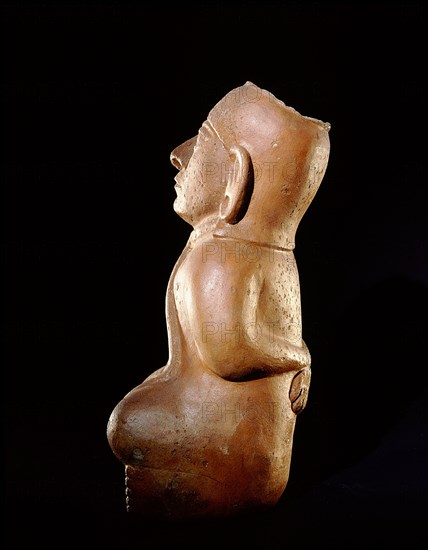 Mochica vessel in the form of a seated prisoner with his hands bound behind his back