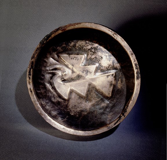 This silver dish, with an Inca geometric design, comes from Ica on the South Coast of Peru
