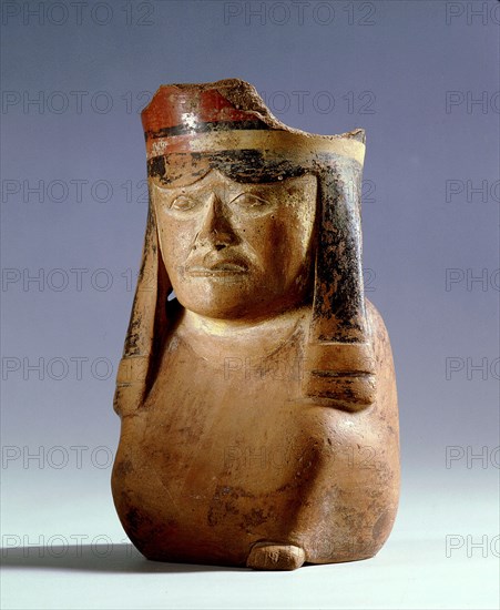 A vessel in the form of a figure of a young noble