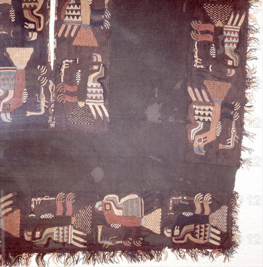 Fragment of black textile, embroidered with a menagerie of different coloured birds