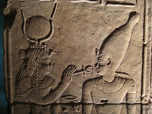 Relief from the inner sanctum wall of the Temple of isis depicting the goddess resurrecting Osiris with the ankh, the Egyptian sign for life